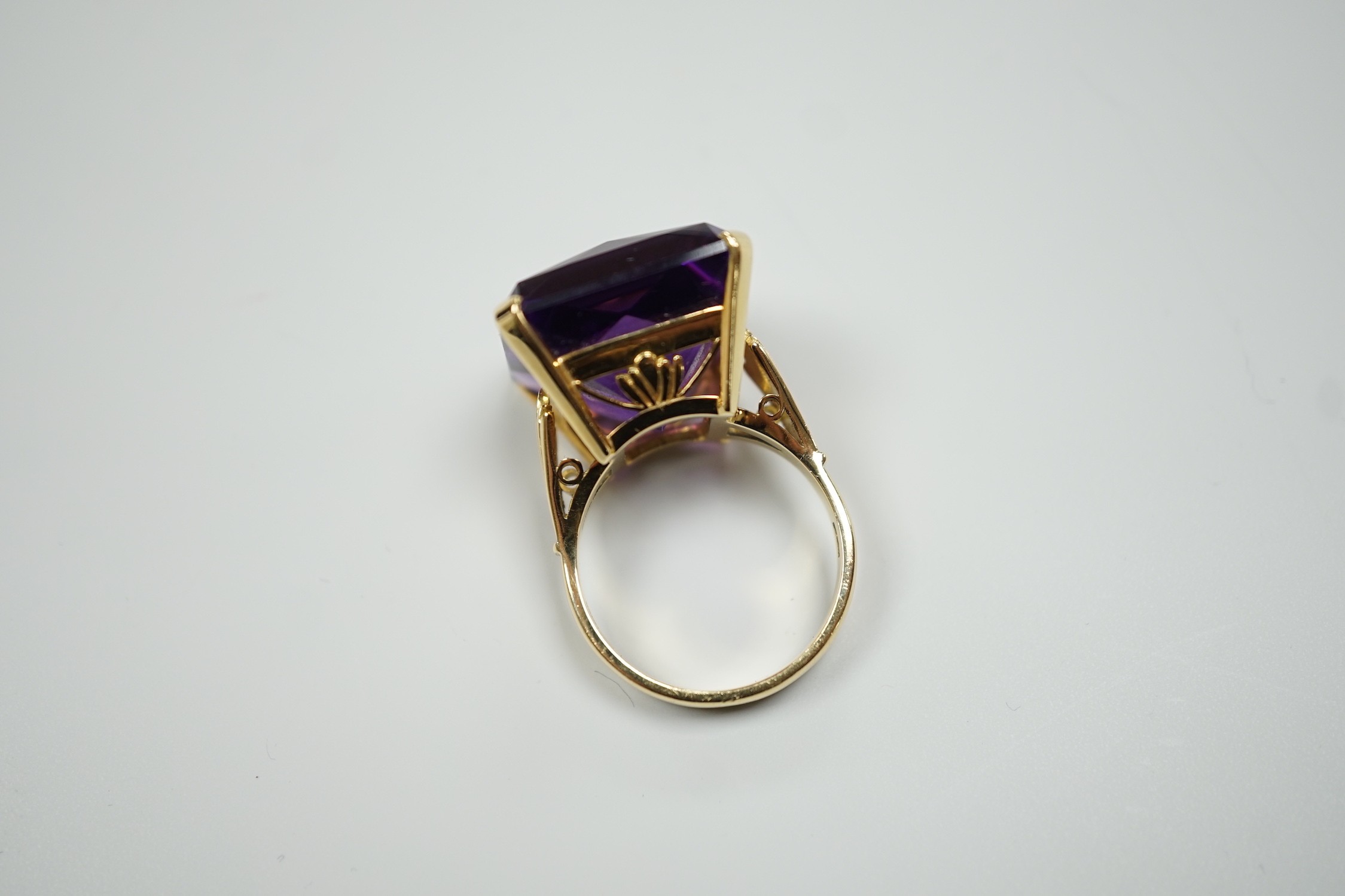 A large modern 18ct gold and fancy rectangular cut single stone amethyst set dress ring, size W, gross weight 22 grams